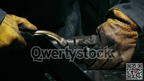 Close-up of a blacksmith welder working with metal using a welding machine, bright sparks and flashes in slow motion