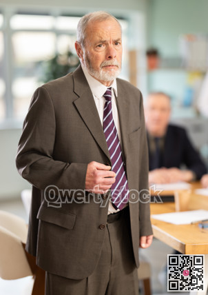 Upset senior man conference participant or partner is reprimanded