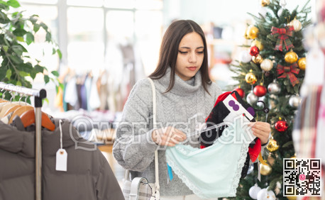 Young girl choosing panties in clothing store