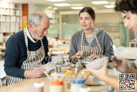 Young woman and man and elderly man crafting ceramics