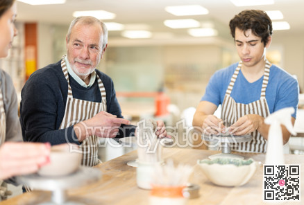 Young woman and man and elderly man crafting ceramics