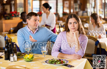 Man and his wife quarreling in restaurant
