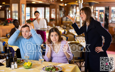 Wife scolding husband spending time with another woman in restaurant
