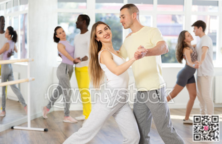 Young man and woman dancing latin dances