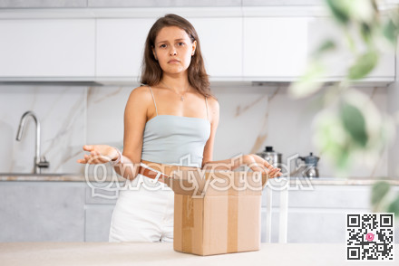 Woman inspects package