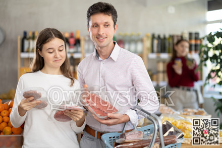 Father and daughter choose raw cooled beef entrecote and hamburger cutlet in shop