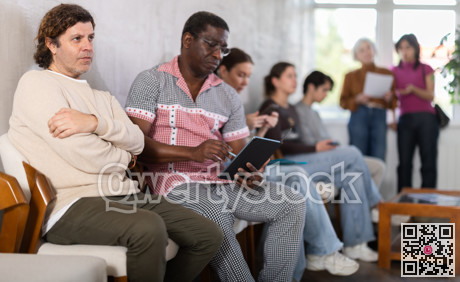 People are sitting in line and waiting for an interview