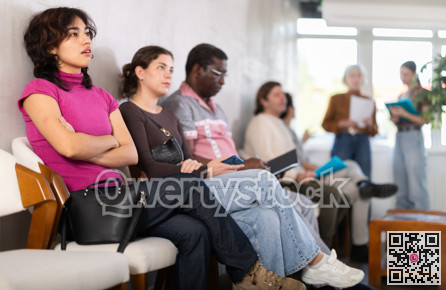 Young girl applicant sitting in a queue at a modern office