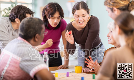 Group of people playing board game