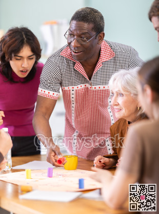 Group of people playing board game