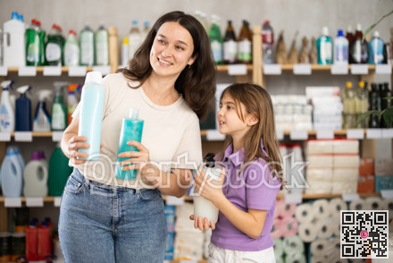 Woman with child family select and studies label shampoo or shower gel