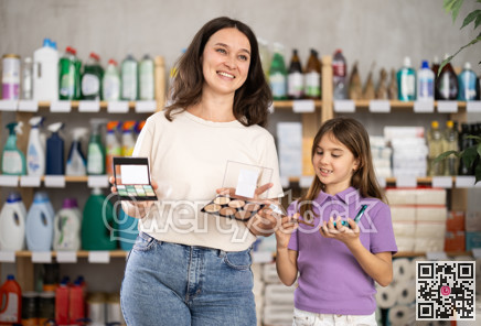 woman and daughter choose cosmetics in a pharmacy near the shelves