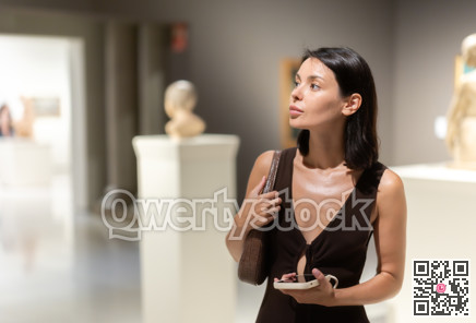 Young woman at a sculpture exhibition