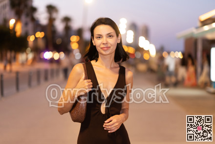 Young woman walking on promenade of Barceloneta