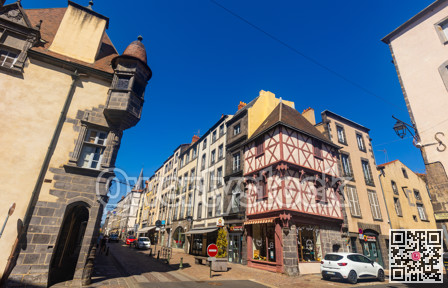 Streets in historic quarter of Riom with ancient half-timbered house