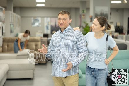 Couple visiting store in search of new furnishings for apartment
