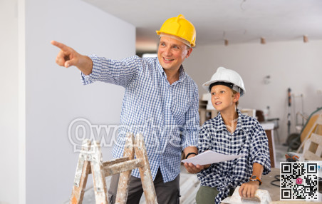 Father and son talking about space planning in new apartment