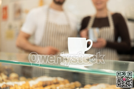 Close-up of cup of coffee on counter at coffee shop