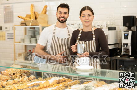 Girl and guy barista at public catering place