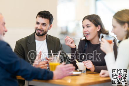 Family day. Multiage family drink coffee or juice in restaurant