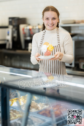Teenage girl offering delicious ice cream in a coffee shop