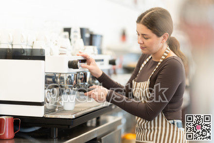 Girl coffee shop employee at work