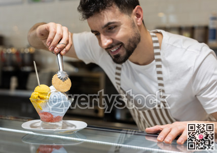 Guy chef or vendor serves ice cream