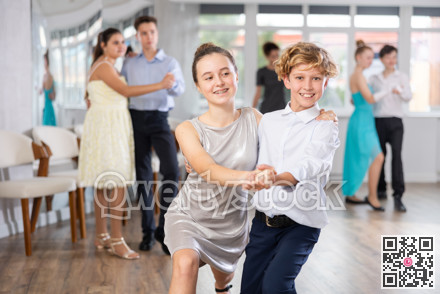 Viennese Waltz performed by teenage girls and boys in dance studio