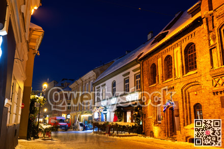 Night view of illuminated Pilies street in Old Town of Vilnius, Lithuania