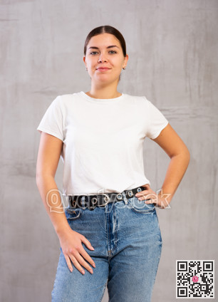 Calm young woman standing in confident pose