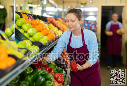 female seller selling peppers