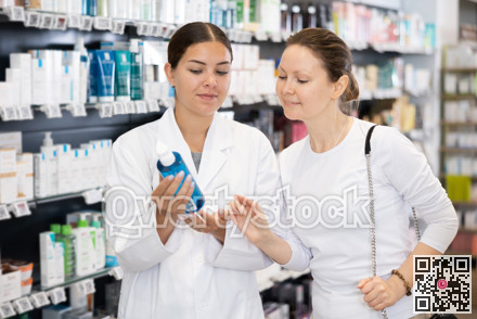 In cosmetic department of pharmacy, buyer asks consultant to help and choose cleansing gel.