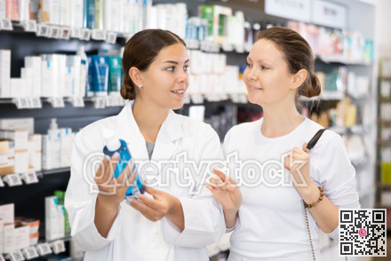 In cosmetic department of pharmacy, buyer asks consultant to help and choose cleansing gel.