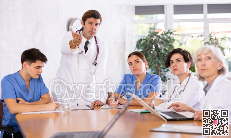 Doctor conducting medical council with colleagues in office