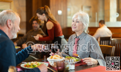 Mature couple communicate and chatting during date in cafe