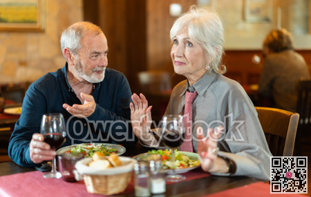 Mature couple communicate and chatting during date in cafe