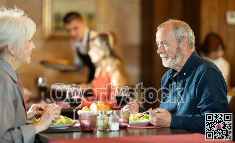 Mature couple communicate and chatting during date in cafe