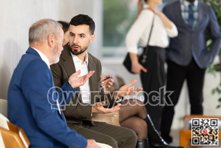 Mature man talking to company manager
