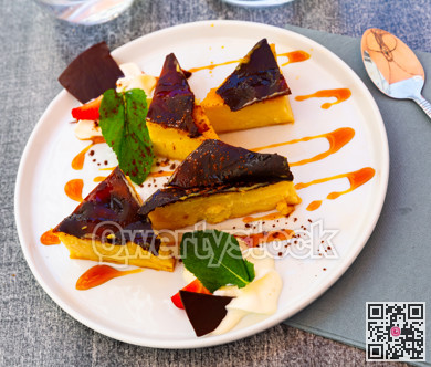 Custard tart on white plate, french cuisine