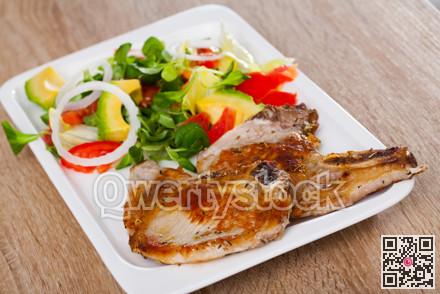 Pork chops with vegetable salad