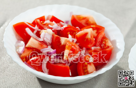 Fresh salad with tomatoes and chopped onion