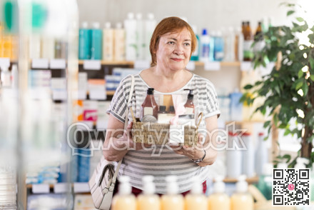Senior woman are busy choosing bath cosmetic set at pharmacy
