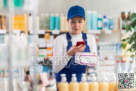 Builder woman in pharmacy scans QR code on feminine pads
