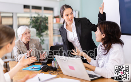 Angry group of female colleagues arguing during office meeting
