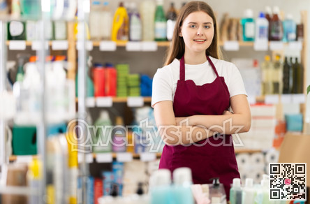 Girl store employee working in sales area