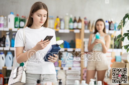 Girl scanning spray barcode on her phone