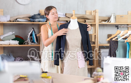 Woman dressmaker with a ready-made jacket