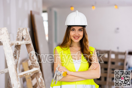 Portrait of a young seductive woman engineer in uniform