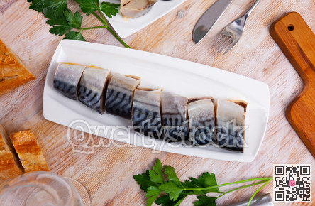Salted scomber with baguette on plate
