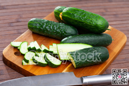 Sliced cucumbers on wooden table, food ingredients